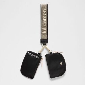 NWT Lululemon dual pouch wristlet/ pouch in black & gold wordmark
